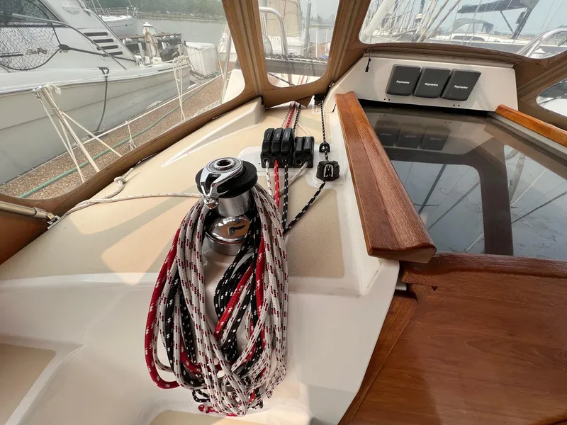 Slide: The Image of Sailboat cockpit of 2007 Tartan 3400 with ropes and winch. - 22