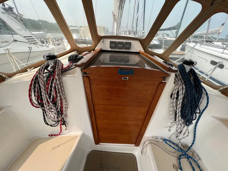 Slide: The Image of 2007 Tartan 3400 sailboat cockpit with ropes and wooden hatch. - 24