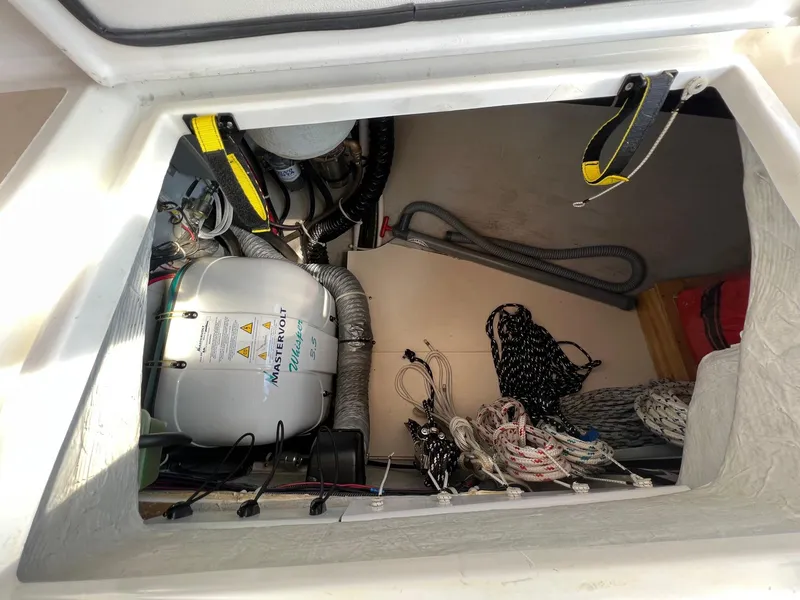 Slide: The Image of Tartan 3400 sailboat engine compartment, 2007 model, with ropes and equipment. - 33