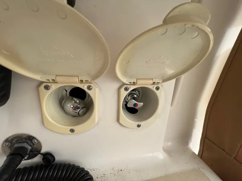 Slide: The Image of Boat deck fittings on a 2007 Tartan 3400, featuring open access hatches. - 36