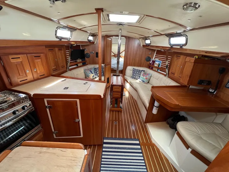 Slide: The Image of Luxurious 2007 Tartan 3400 yacht interior with wood finish and cozy seating area. - 48