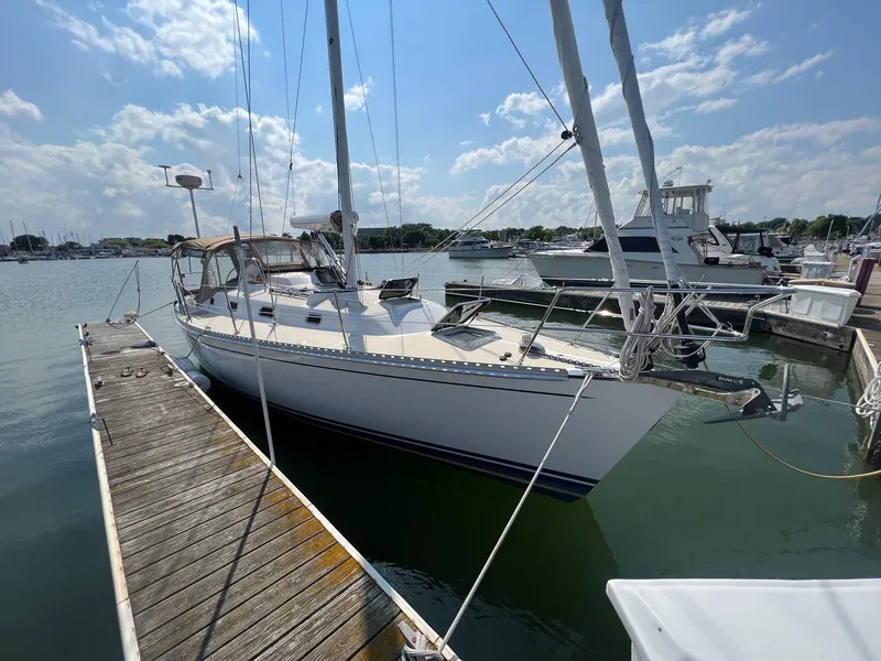 Slide: The Image of Sailboat Tartan 3400, 2007 model, docked at marina under blue sky. - 5