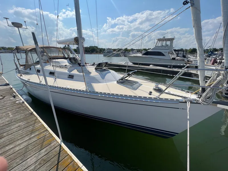 Slide: The Image of Sailboat docked at marina, Tartan 3400 model, 2007, under clear blue sky. - 6