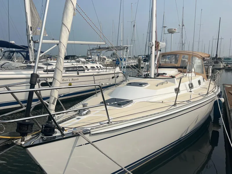 Slide: The Image of Sailboat Tartan 3400, 2007 model, docked in a marina with other boats. - 7