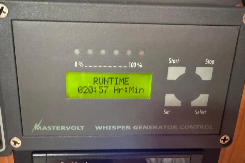 Slide: The Image of Mastervolt Whisper Generator Control displaying runtime of 20 hours and 57 minutes. - 82