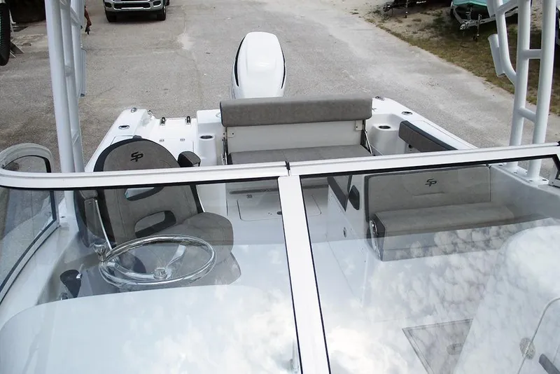 Slide: The Image of 2026 Sea Pro 240 Dual Console Deluxe boat interior with seating and steering wheel. - 15