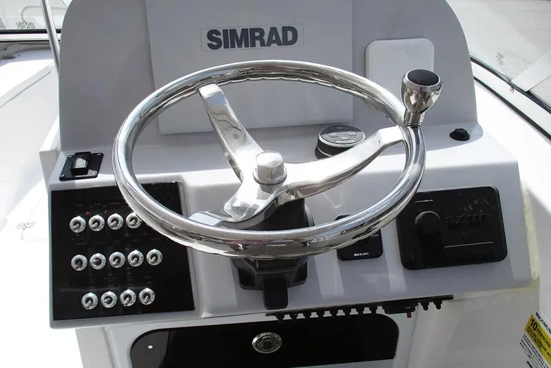 Slide: The Image of Steering console of 2026 Sea Pro 240 Dual Console Deluxe boat with Simrad system. - 18