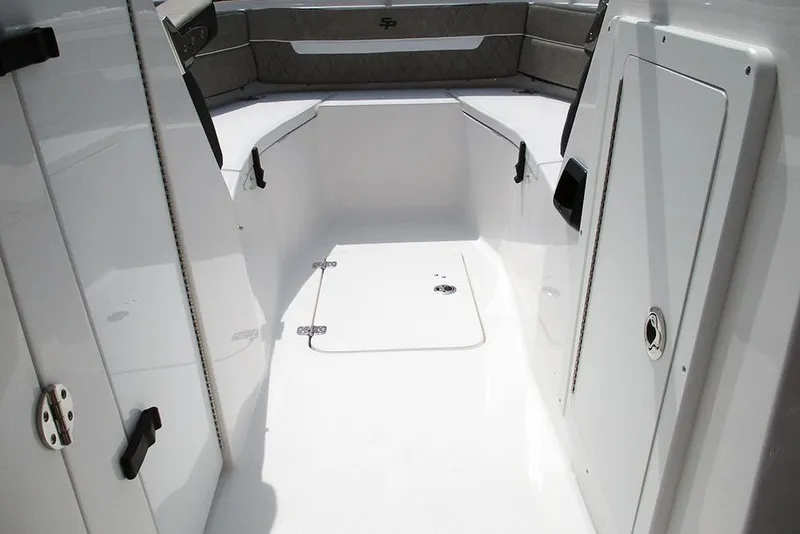Slide: The Image of 2026 Sea Pro 240 Dual Console Deluxe interior with sleek white finish and seating. - 22