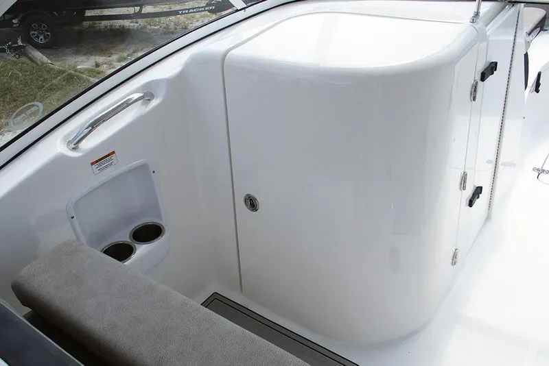 Slide: The Image of 2026 Sea Pro 240 Dual Console Deluxe interior with seating and storage compartments. - 25