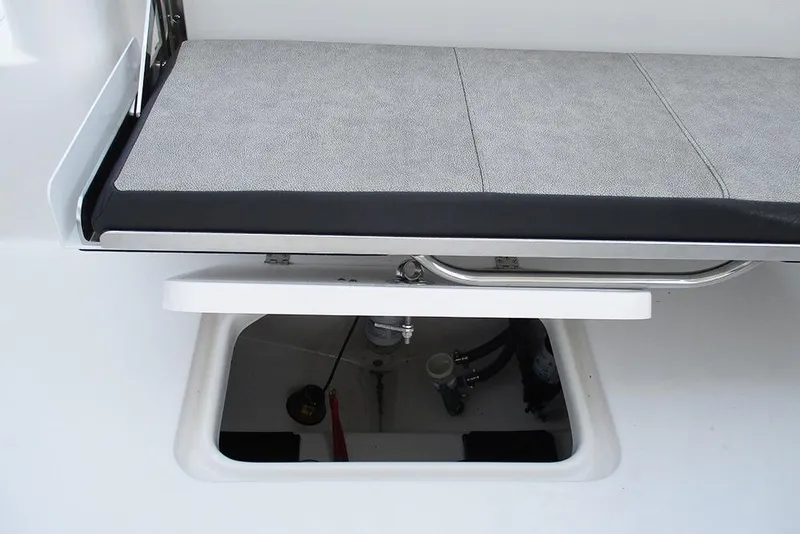 Slide: The Image of 2026 Sea Pro 240 Dual Console Deluxe boat seat with storage compartment open. - 33