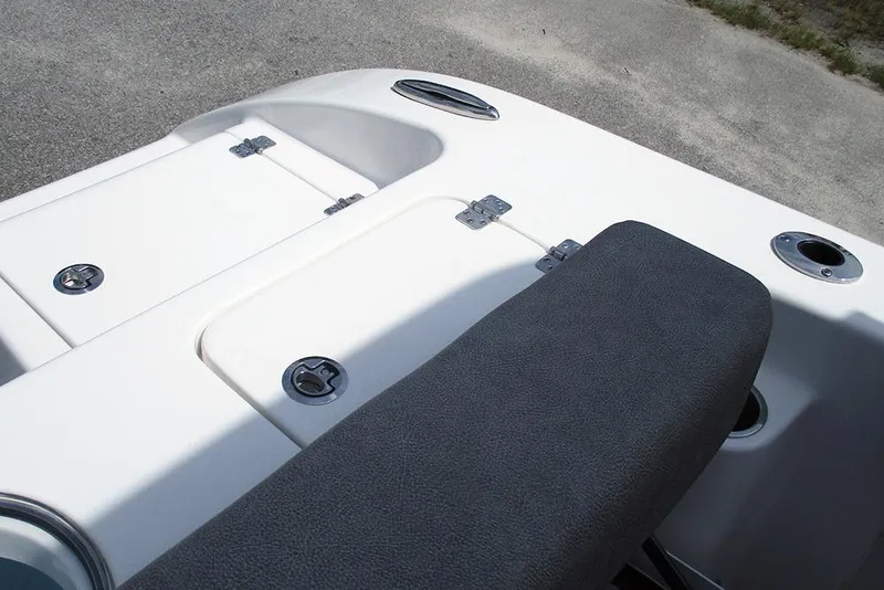 Slide: The Image of 2026 Sea Pro 240 Dual Console Deluxe boat interior with storage compartments and seating. - 38
