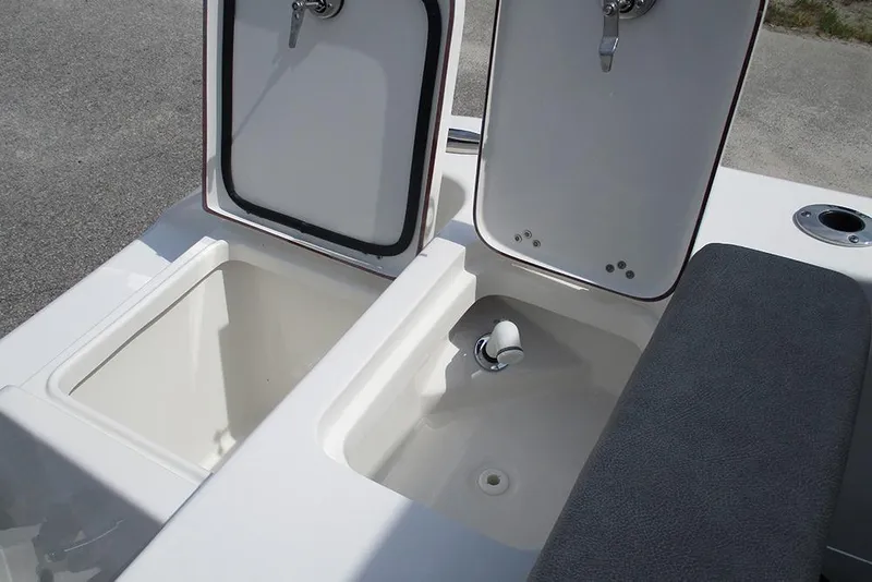 Slide: The Image of 2026 Sea Pro 240 Dual Console Deluxe boat storage compartments and seating detail. - 39