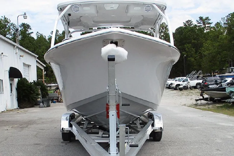 Slide: The Image of 2026 Sea Pro 240 Dual Console Deluxe boat on trailer in outdoor setting. - 4