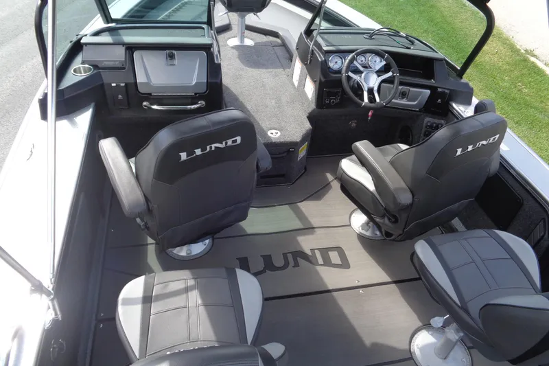 Slide: The Image of 2026 Lund 2075 Pro-V Sport boat interior with seating and steering console. - 10