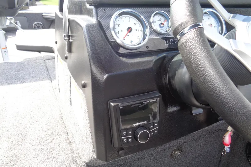 Slide: The Image of 2026 Lund 2075 Pro-V Sport dashboard with gauges and steering wheel. - 14