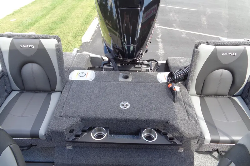 Slide: The Image of 2026 Lund 2075 Pro-V Sport boat interior with seating and motor, showcasing modern design. - 21