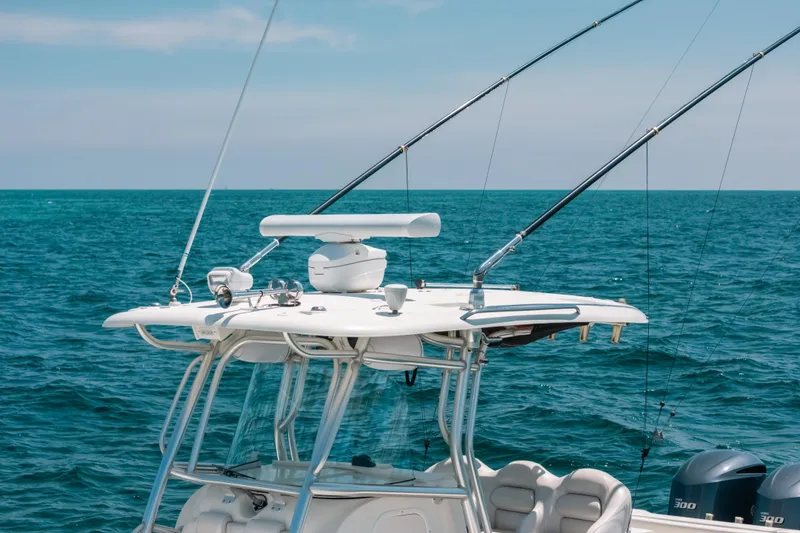 Slide: The Image of 2008 Hydra-Sports Vector 3300 CC boat with fishing rods on open sea. - 10