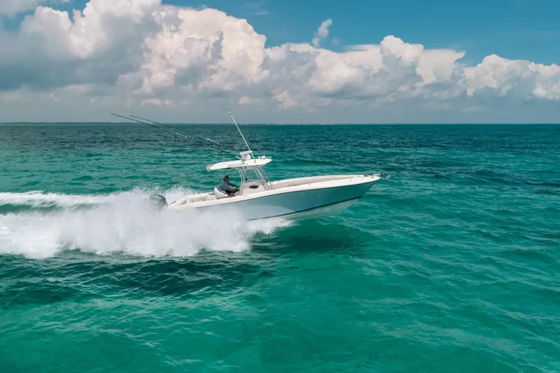 Slide: The Image of 2008 Hydra-Sports Vector 3300 CC speeding on turquoise ocean under cloudy sky. - 12