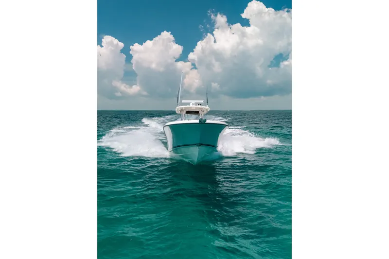 Slide: The Image of 2008 Hydra-Sports Vector 3300 CC cruising on open ocean under cloudy sky. - 14