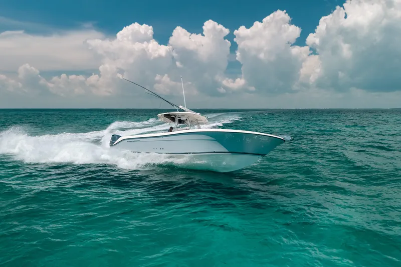 Slide: The Image of 2008 Hydra-Sports Vector 3300 CC cruising on open ocean under cloudy sky. - 15