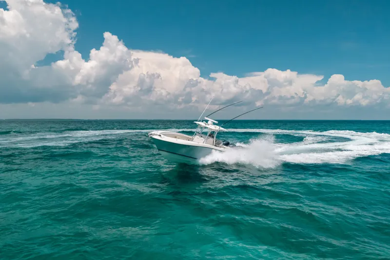 Slide: The Image of 2008 Hydra-Sports Vector 3300 CC cruising on vibrant ocean waters under a clear sky. - 16