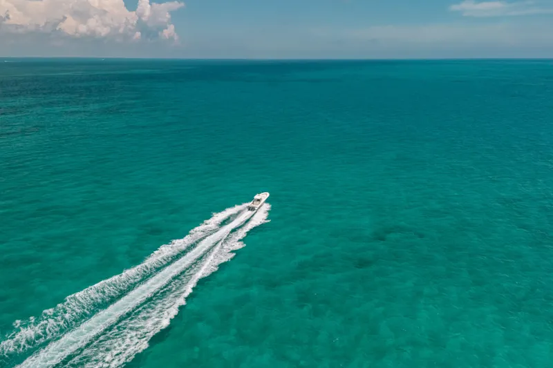 Slide: The Image of 2008 Hydra-Sports Vector 3300 CC cruising on clear turquoise ocean waters. - 18