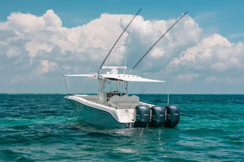 Slide: The Image of 2008 Hydra-Sports Vector 3300 CC boat on ocean with triple Yamaha engines. - 24