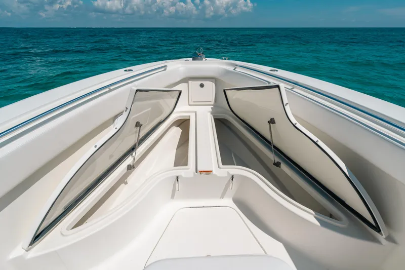 Slide: The Image of 2008 Hydra-Sports Vector 3300 CC boat with open storage compartments on the ocean. - 31