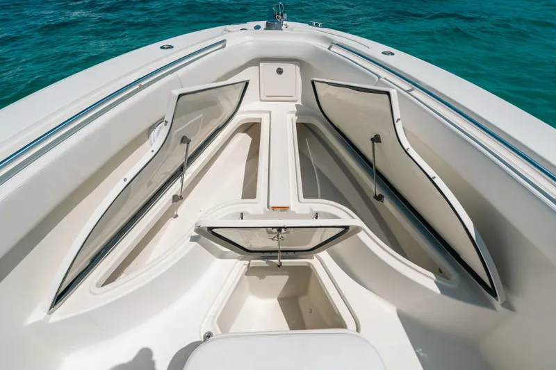 Slide: The Image of 2008 Hydra-Sports Vector 3300 CC boat storage compartments open on clear blue water. - 32