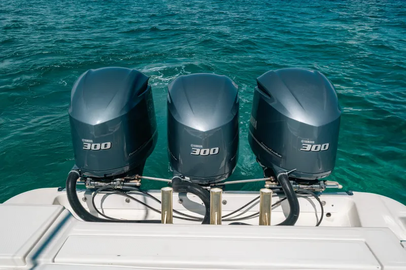 Slide: The Image of Triple Yamaha 300 engines on a 2008 Hydra-Sports Vector 3300 CC in clear blue water. - 35