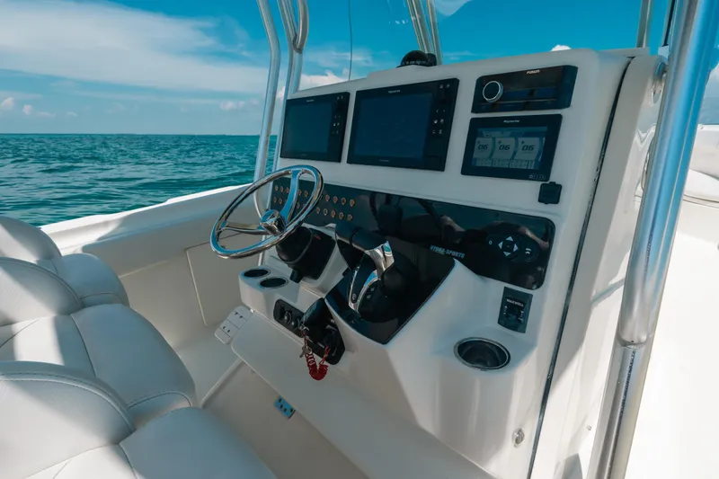 Slide: The Image of 2008 Hydra-Sports Vector 3300 CC boat dashboard with steering wheel and navigation screens. - 39
