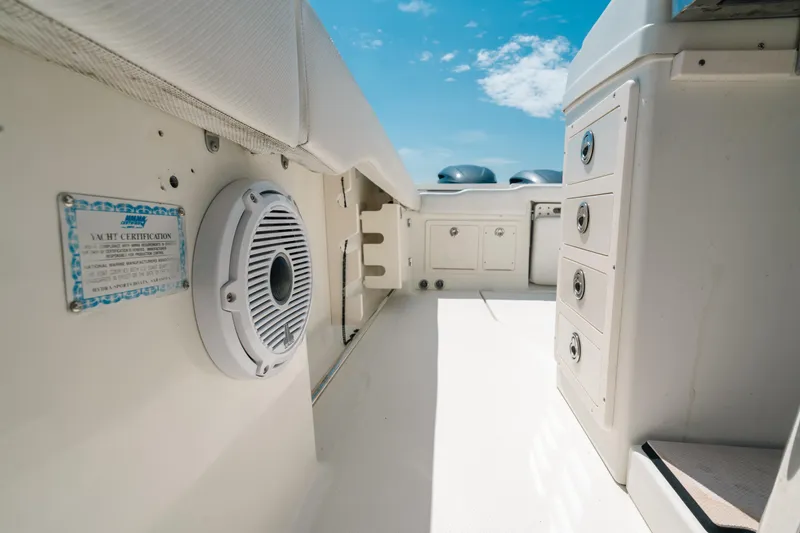 Slide: The Image of 2008 Hydra-Sports Vector 3300 CC interior with storage and speaker, under clear blue sky. - 42