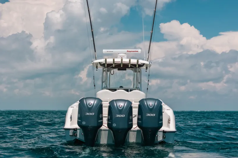 Slide: The Image of 2008 Hydra-Sports Vector 3300 CC boat with triple Yamaha engines on open sea. - 5