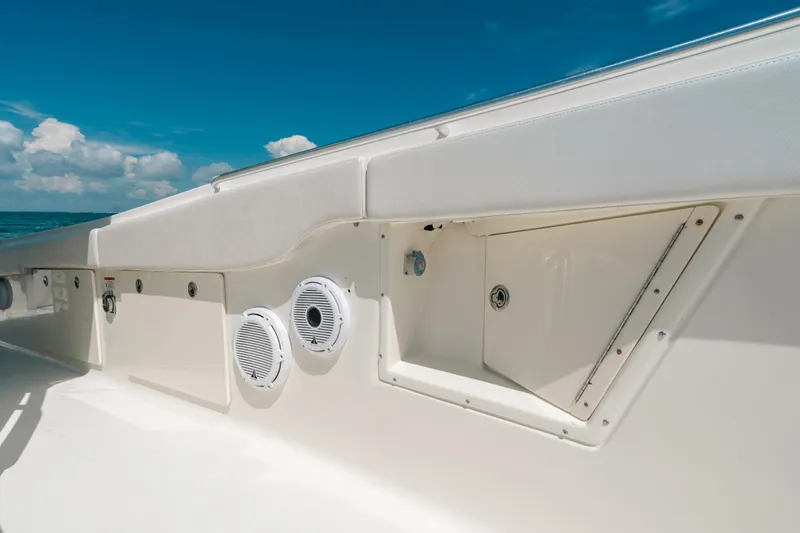 Slide: The Image of 2008 Hydra-Sports Vector 3300 CC boat interior with speakers, under a clear blue sky. - 51