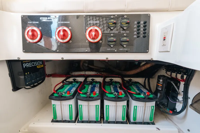Slide: The Image of 2008 Hydra-Sports Vector 3300 CC boat battery compartment with control panel and wiring. - 53