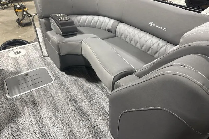 Slide: The Image of 2024 Bennington 25QFBWA boat interior with luxurious gray seating and modern design. - 5