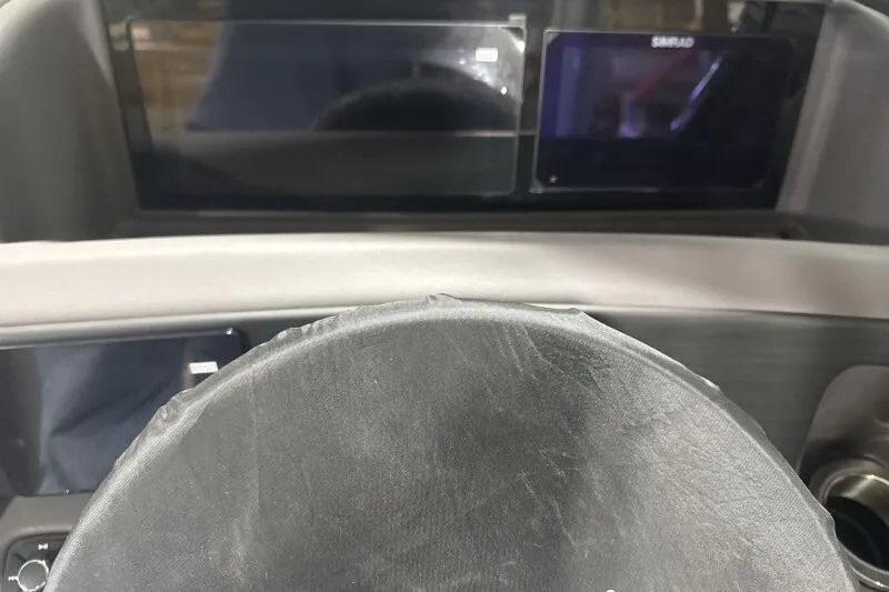 Slide: The Image of 2024 Bennington 25QFBWA dashboard with modern digital displays and steering wheel. - 7