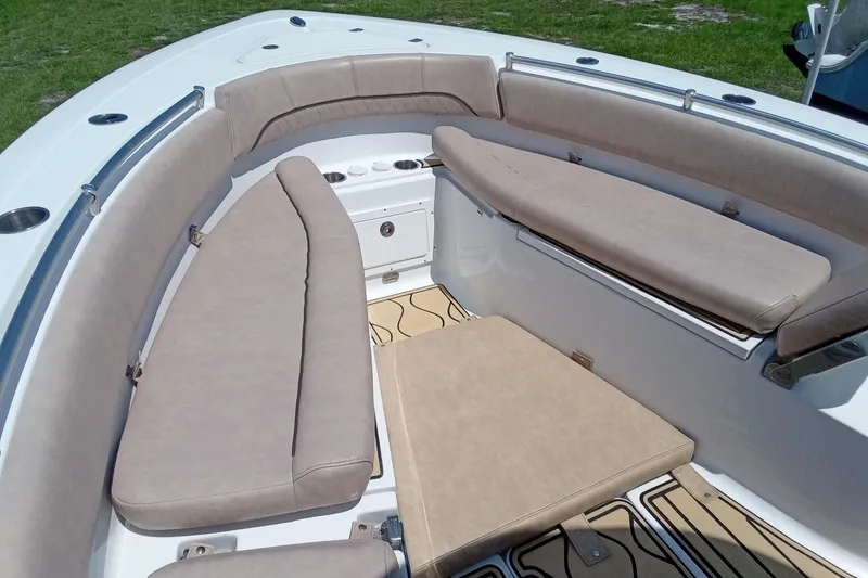 Slide: The Image of 2020 Sportsman Open 282 Center Console boat interior with cushioned seating. - 10