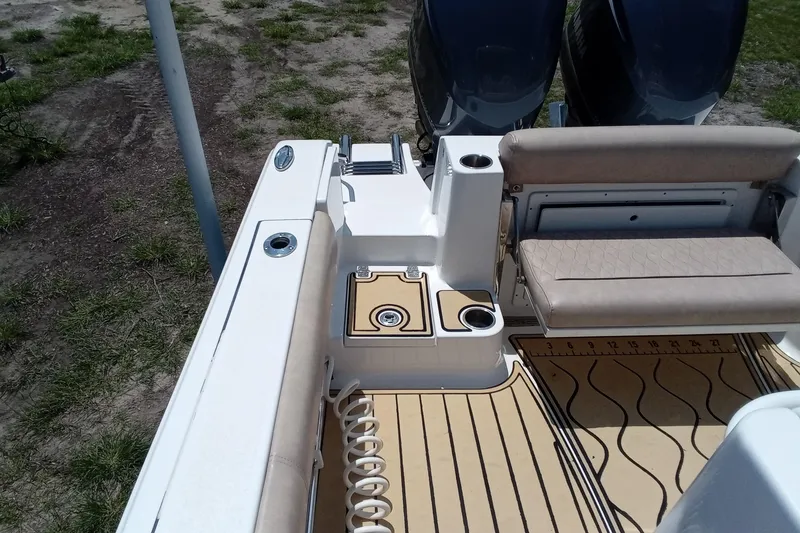 Slide: The Image of 2020 Sportsman Open 282 Center Console boat interior with seating and deck details. - 20