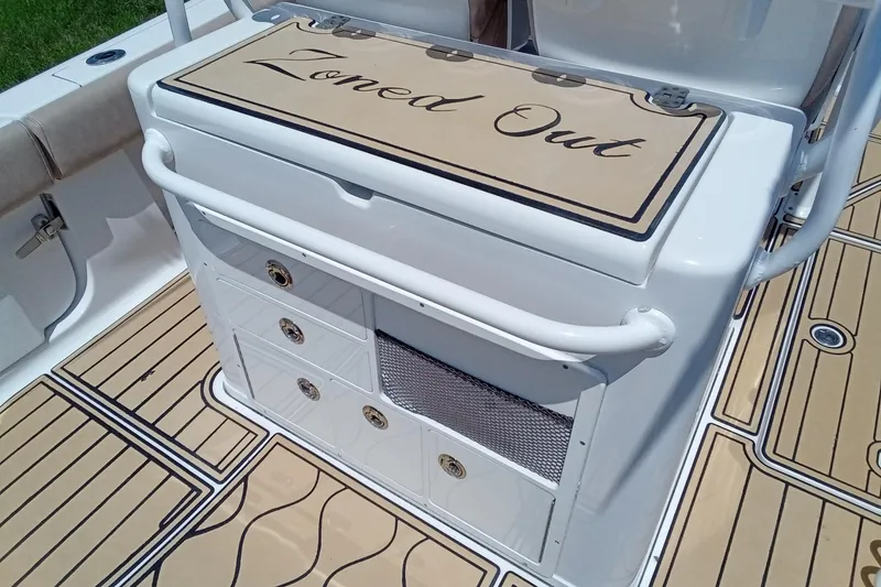 Slide: The Image of 2020 Sportsman Open 282 Center Console boat with "Zoned Out" inscription on deck. - 23