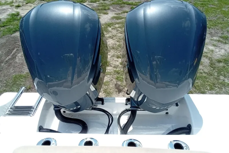 Slide: The Image of Twin outboard engines on a 2020 Sportsman Open 282 Center Console boat. - 27