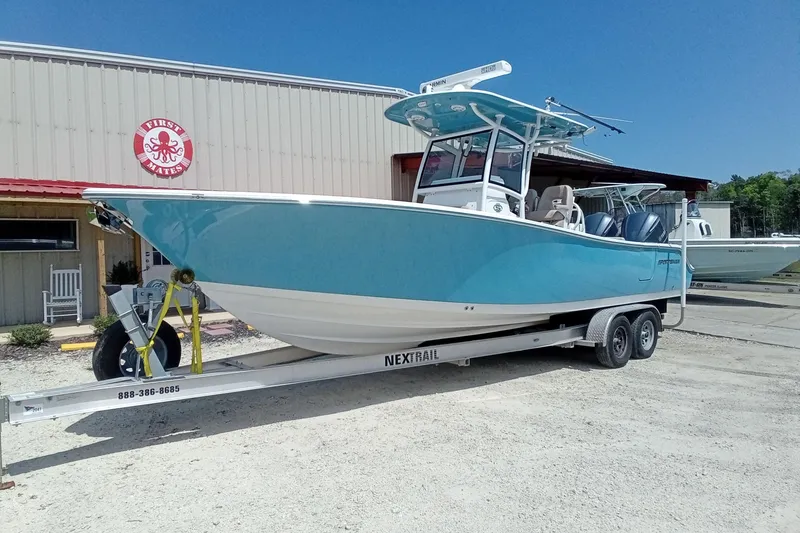 Slide: The Image of 2020 Sportsman Open 282 Center Console boat on trailer outside a building. - 29