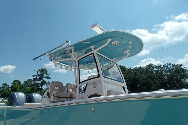 Slide: The Image of 2020 Sportsman Open 282 Center Console boat under clear blue sky. - 33