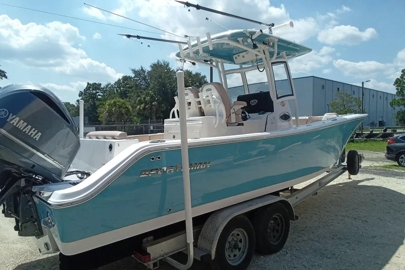 Slide: The Image of 2020 Sportsman Open 282 Center Console boat on trailer, featuring Yamaha engine. - 34