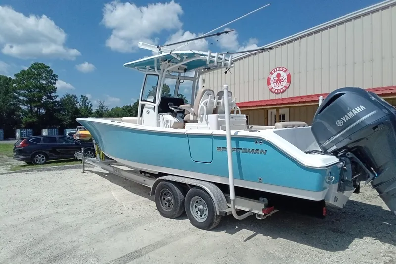 Slide: The Image of 2020 Sportsman Open 282 Center Console boat on trailer, parked outdoors. - 36