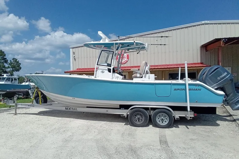 Slide: The Image of 2020 Sportsman Open 282 Center Console boat on trailer, parked outdoors. - 37