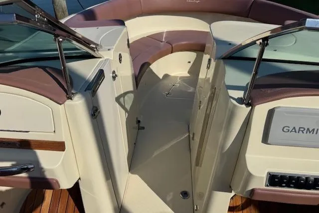 Slide: The Image of 2019 Chris-Craft Launch 30 boat interior with seating and Garmin navigation system. - 11