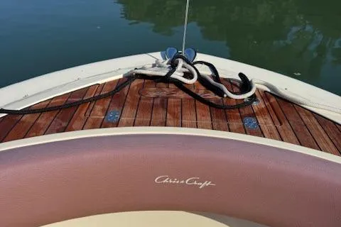 Slide: The Image of 2019 Chris-Craft Launch 30 boat with teak deck and mooring lines. - 14
