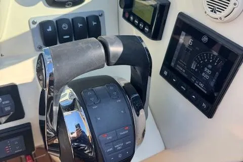 Slide: The Image of 2019 Chris-Craft Launch 30 dashboard with throttle controls and digital display. - 16