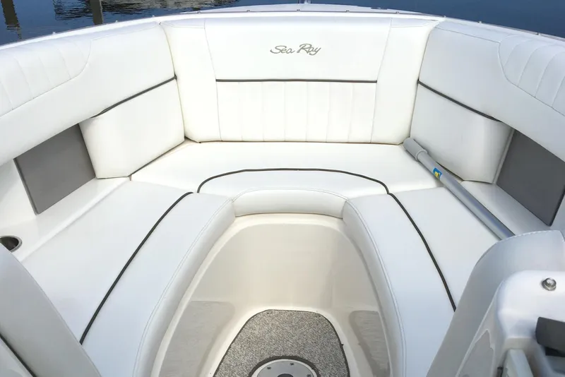 Slide: The Image of 2008 Sea Ray 270 SLX boat interior with white cushioned seating and sleek design. - 11